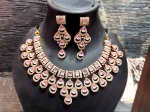 Rose Luxe Teardrop Necklace & Earrings Set designed with soft <b>blush</b>-pink teardrop stones arranged in a layered fringe pattern - Product Image 3