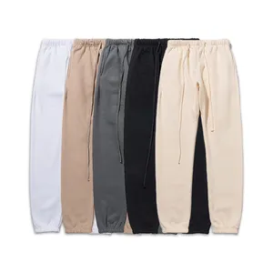 Pantalones de chándal para hombre y mujer, pantalones de chándal deportivos informales de algodón y forro polar, elásticos, de Color sólido, con logotipo de diseño personalizado - Product Image 1