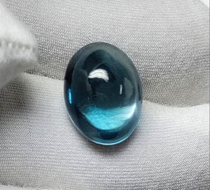 Attractive London Blue Topaz 11x9mm - 12x10mm พลอยรูปไข่สีน้ำเงินเข้ม Topaz Cabochon จากเหมืองบราซิล - Product Image 6