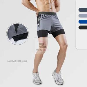 Pantalones cortos atléticos de doble capa unisex, cierre de cintura elástica, patrón sólido ecológico, decoración de encaje de poliéster, servicio OEM - Product Image 4