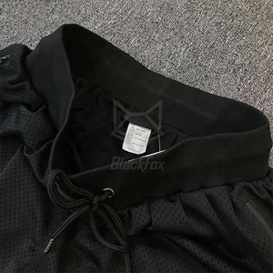 Vente en gros de shorts de basket-ball sportifs pour hommes avec logo personnalisé poches zippées en maille de polyester solide - Product Image 4