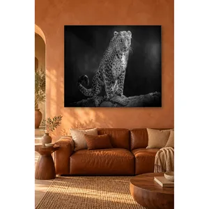 Impression sur toile de Fida, léopard noir et blanc assis sur une roche - Product Image 1