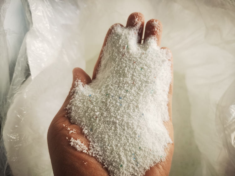 White powder with blue/green pigment