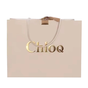 Sac en papier personnalisé avec logo en relief, sac en papier décoratif avec poignées en ruban pour l'emballage de marques de luxe - Product Image 1