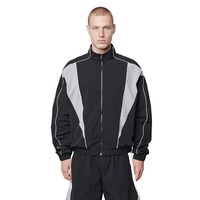 Coupe-vent sportif tendance en nylon uni pour homme avec bandes réfléchissantes sur les épaules, empiècements contrastants, fermeture éclair et séchage rapide