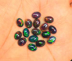 พลอยโอปอลทรงหลังเบี้ยสีดำทรงวงรีสีดำที่น่าสนใจสำหรับทำเครื่องประดับโอปอลเอธิโอเปียอัญมณีสีดำขัดเรียบขนาด8x6mm - Product Image 1