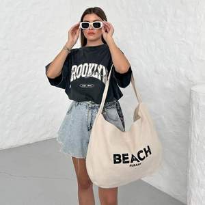 Sac élégant en coton recyclé écologique Poche polyvalente Toutes les saisons Utilisation pour les aventures de voyage à la plage décontractées pour les autres - Product Image 1