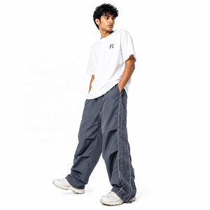 Pantalones anchos tejidos para hombre al por mayor, cintura elástica, ribete lateral reflectante, dobladillo ajustable, pantalones casuales de moda, ropa urbana personalizada - Product Image 3