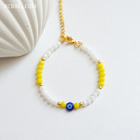 Bracelets en perles de cristal avec breloque œil porte-bonheur, style bohème, cadeau pour femme, symbolisme protecteur et design avant-gardiste