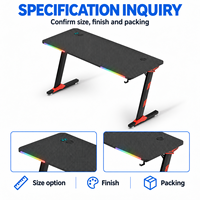 Bureau de jeu noir avec plateau nervuré, accents RGB à l'avant et pieds rouges pour bureaux à domicile, salles d'étude et salles de jeu