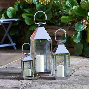 Linterna de vela rústica de acero inoxidable con acabado de níquel y detalles desgastados para decoración y eventos temáticos vintage - Product Image 6