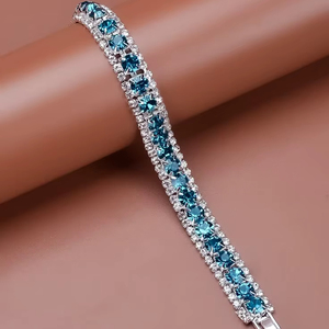 Pulsera de tenis de moissanita de color zafiro azul de lujo para mujer – Pulsera con halo de diamantes – Joyería de boda brillante de corte redondo - Product Image 1
