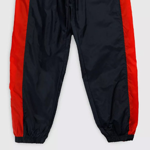 Pantalones para correr deportivos de invierno de nailon de alta calidad para mujer, cortavientos reflectante con estampado holgado de gran tamaño, pista delantera plana, raya lateral - Product Image 5