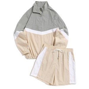 Vente en gros de short coupe-vent unisexe pour hommes, ensemble short coupe-vent zippé de couleur fendue en polyester 100%, vêtements de jogging - Product Image 1