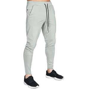 Pantalones de nuevo diseño al por mayor para hombre Pantalones tobilleros pequeños ajustados informales con estampado de puntos de color sólido - Product Image 1