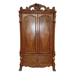 Mayora classic wardrobe made of solid mahogany wood with traditional wood carvings and a shiny brown finish.