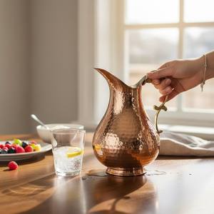 Pichet en cuivre artisanal en forme de canard - Product Image 1