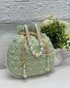 2025 @ Beautiful Olive Green Potli Bags en tela de seda con perlas adornadas, cuentas de cristal para fiesta/boda - Product Image 1