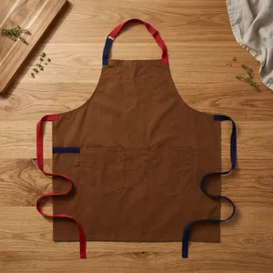 Delantal sin Mangas de Lona Marrón con Tirantes Rojos y Azules, Cintura Ajustable, Dos Bolsillos, Reutilizable, Estilo Clásico para Cocinar y Uso Diario - Product Image 1