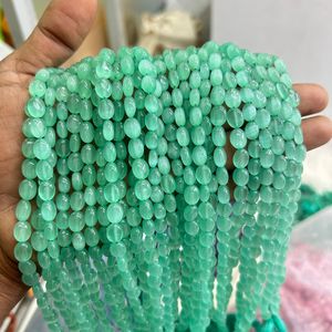 Perles en vrac Monalisa vert clair Pierre précieuse lisse plate et ovale avec propriétés curatives - Product Image 3