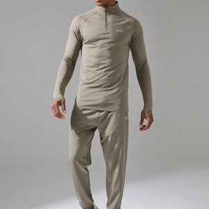 Venta al por mayor de ropa deportiva personalizada de calidad premium para hombre, chándal para correr con cremallera de cuarto de verano sólido, transpirable, de secado rápido, ligero - Product Image 1