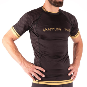 Haute qualité MMA personnalisé éruption pour la formation à manches courtes Compression Spandex toile conception solide enfants hommes BJJ combat - Product Image 1