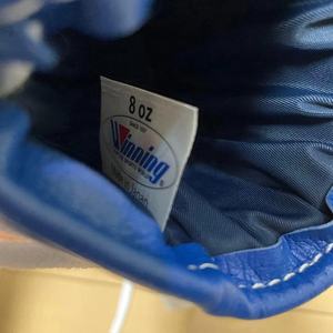 Gants de boxe professionnels en cuir véritable à lacets Winning à vendre Entraînement de kickboxing Rembourrage confortable Gants de vol - Product Image 5