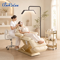 Lit de massage électrique UniRelax moderne à 3 moteurs, hauteur réglable, en PU pliable pour les soins du visage en salon de beauté