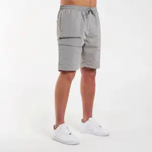 Pantalones cortos de malla deportiva de fabricación personalizada OEM para adolescentes: aspecto deportivo, material de secado rápido, multiusos