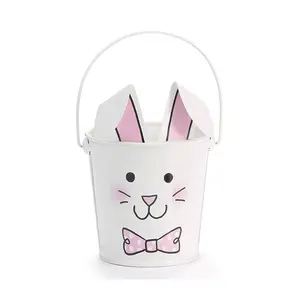 The Bunny Basket Has a Pink Bow Tie Bunny Face Pail White Colour With Ears Stick & Foldable Handle Out of The Top Wholesale BUlk