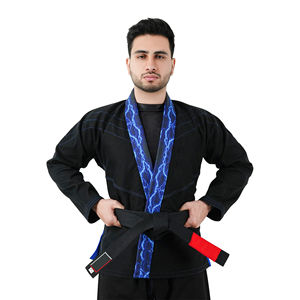 Uniforme de entrenamiento de algodón/poliéster personalizado, traje de Karate unisex OEM con traje de uniforme de Karate de diseño personalizado - Product Image 1