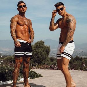 กางเกงว่ายน้ำขาสั้นแห้งเร็วสีเหลืองสำหรับผู้ชายกางเกงว่ายน้ำแบบผูกเอวกางเกงรัดรูปสำหรับเล่นกีฬากางเกงลำลองลายทางด้านข้างสำหรับใส่ไปทะเล - Product Image 4