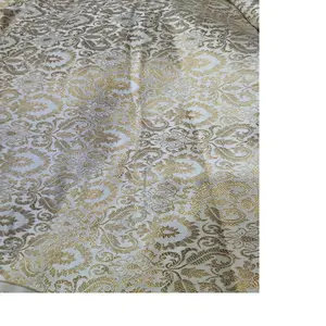 custom made white and gold woven brocade silk fabrics ideal for dress designers and fashion designers suitable for use in home.