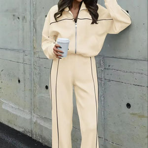 Streetwear d'automne avec fermeture éclair en coton délavé à l'acide personnalisé Survêtement à imprimé animal Ensemble de pantalons de survêtement évasés à capuche pour femmes avec strass - Product Image 1