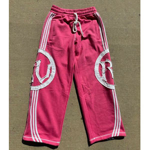 Pantalons de survêtement vintage surdimensionnés de qualité supérieure avec broderie graphique et détails de patchs usés - Product Image 1