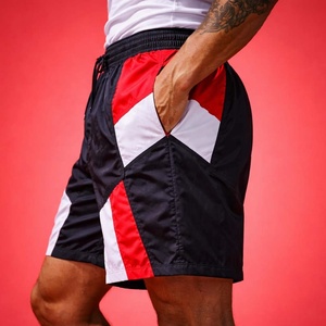 กางเกงขาสั้นวินด์เบรกเกอร์สไตล์เรโทรสำหรับผู้ชาย ผ้าโพลีเอสเตอร์ 100% ใส่สบาย เหมาะสำหรับวิ่งและเล่นกีฬา รับสกรีนโลโก้ - Product Image 5