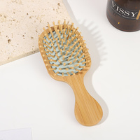 Brosse à cheveux démêlante portable mini écologique en bambou carbonisé durable avec coussin ventilé pour le toilettage quotidien et les voyages