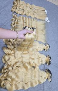 Cheveux vierges blond clair à double trame, légèrement ondulés |   Paquets de cheveux humains vietnamiens |   Prix d'usine |   Texture naturelle douce et soyeuse - Product Image 4