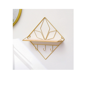 สินค้าตกแต่งผนังทองเหลืองสำหรับห้องนอนและห้องนั่งเล่นและห้องน้ำที่แขวนผนังใช้ขาตั้งและการออกแบบที่ดูเป็นชิ้น - Product Image 1