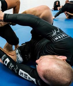 Rashguard à manches courtes noir respirant avec motifs blancs UPF50+ 100% polyester - Product Image 6