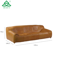 Canapé trois places en cuir véritable style moderne, design vague caramel, pour appartement, chambre, hall d'hôtel, salon