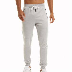 Pantalon pour homme en coton respirant à motif uni avec taille élastique et poches zippées, couleur personnalisée, vêtements d'automne à vendre - Product Image 1