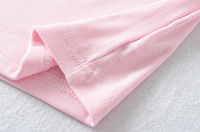 T-shirt tricoté à manches courtes pour femme, nouveau modèle asymétrique avec épaulettes, décoration sans bretelles, design plissé, style doux