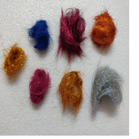 Fibres luminescentes synthétiques de marque Angelina, fabriquées sur mesure, pouvant être utilisées dans les textiles d'art et la fabrication de papier.