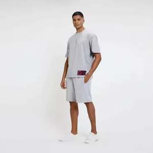 เสื้อยืดคอกลมผ้าคอตตอนสำหรับออกกำลังกายของผู้ชายระบายอากาศได้ดีสีพื้นทรงหลวมไซส์ใหญ่พิเศษและแบบรัดรูป - Product Image 2