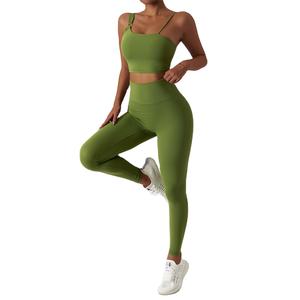 Conjunto de Yoga de alta calidad para mujer, mallas deportivas sin costuras con logotipo personalizado y sujetador, Top liso de compresión con patrón sólido - Product Image 1