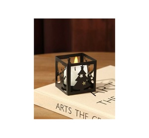 <b>Large</b> <b>pillar</b> style metal Christmas decorative <b>candle</b> holder with bold festive engravings for a stunning centerpiece display - Product Image 2