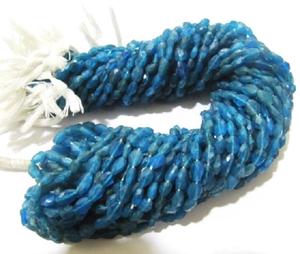 ลูกปัดอพาไทต์สีน้ำเงินนีออนแท้ธรรมชาติ ทรงรีเจียระไน ขนาดประมาณ 4x6 มม. - Product Image 2