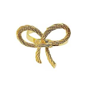 Rollo de tela que cubre el soporte Nudo fundido en forma de servilleta de metal dorado Servilletero - Product Image 1