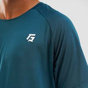 Youth <b>100</b>% <b>Polyester</b> Motion Tee in Teal Breathable Knitted Fabric with Loose Fit and <b>Yarn</b> Dyed Logo Plain Dyed - Product Image 6